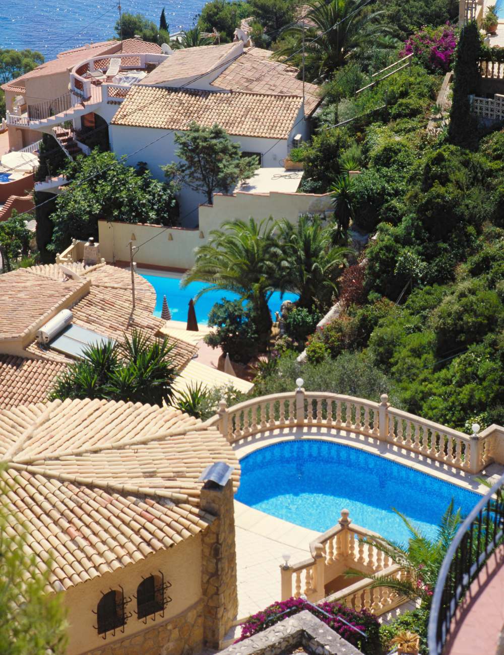 Private villas with pools nestled in the green hills above Calpe