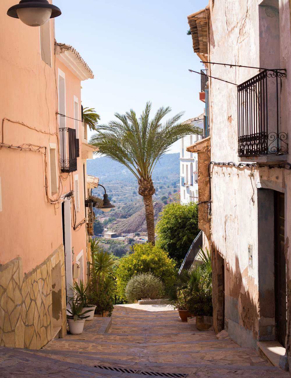 Traditional alley in Finestrat old town with mountain views in the distance
