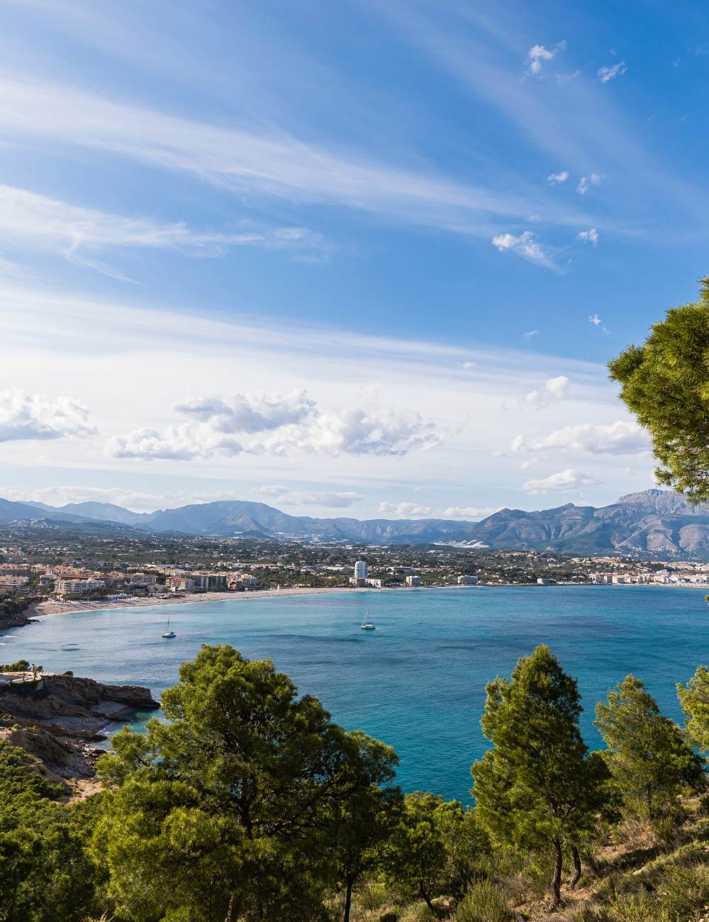 Bay of Altea shows coastline with blue sea and mountains in the background